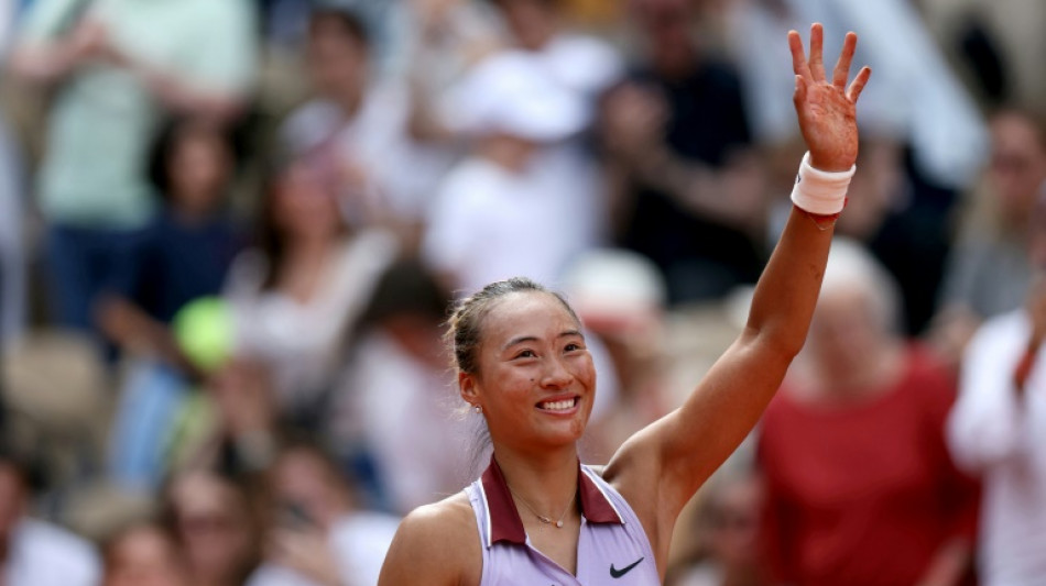Olympic champion Zheng battles into French Open last eight