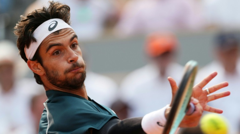 Musetti fights past Tiafoe to meet Alcaraz in French Open semis