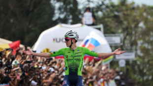 Pogacar defends cycling world title with solo run