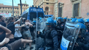 Lancio di bomba carta da manifestanti e carica della Polizia a Bologna