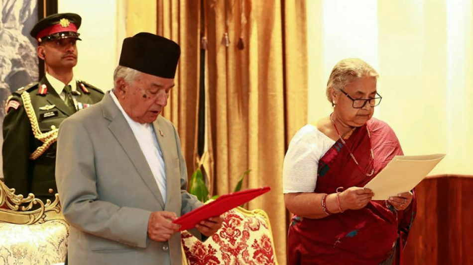 Nepal returns to calm as first woman PM takes charge