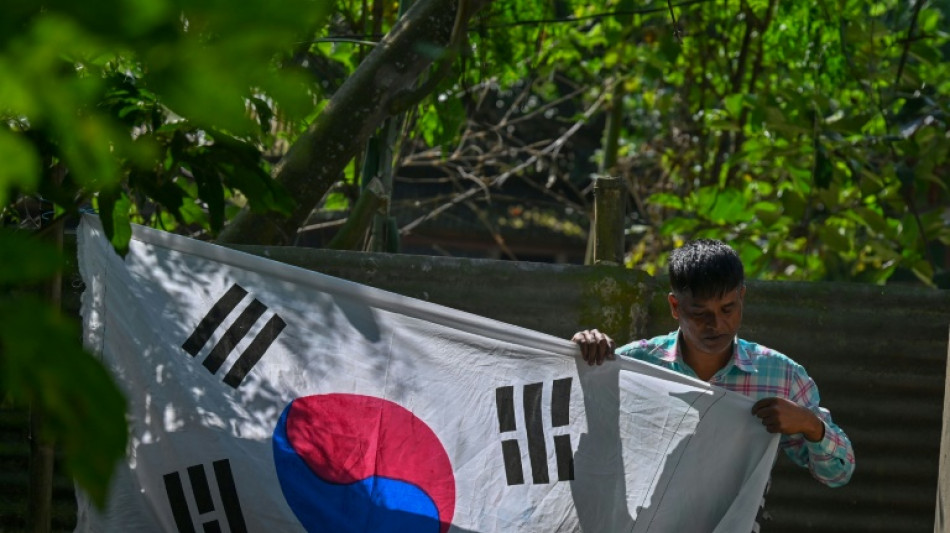 Spurning World Cup favourites, Bangladeshi duo hoist South Korean colours