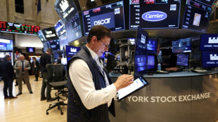 Wall Street termine pr&egrave;s de l'&eacute;quilibre, surmonte ses craintes sur le budget am&eacute;ricain