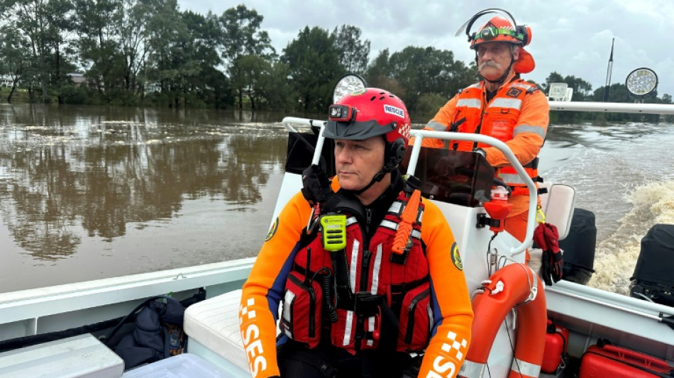 Flood victims stranded on roofs as downpours lash eastern Australia
